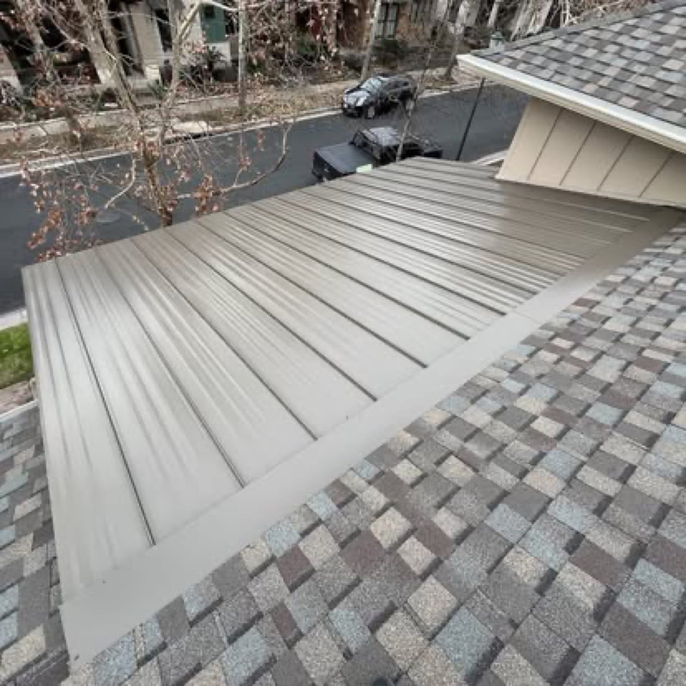 Sutton crew fitting metal roof panels