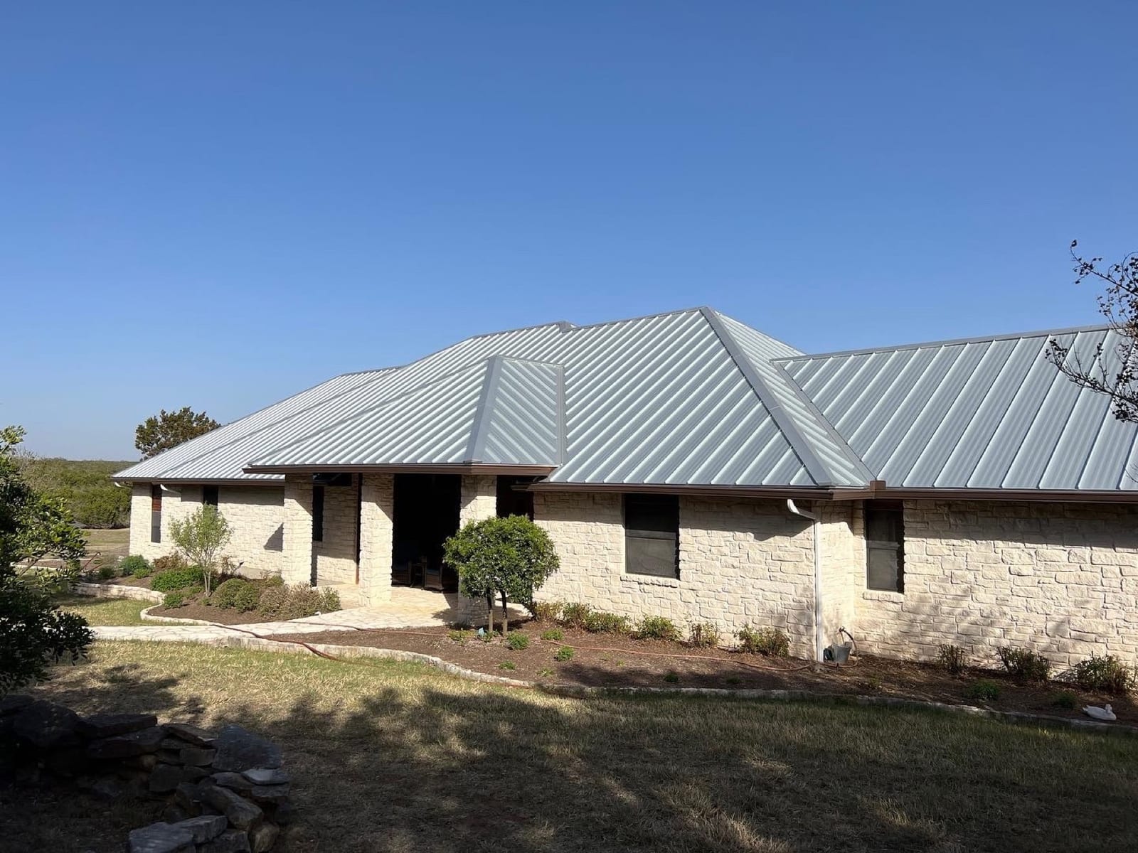 Standing seam metal roof on a Hill Country home