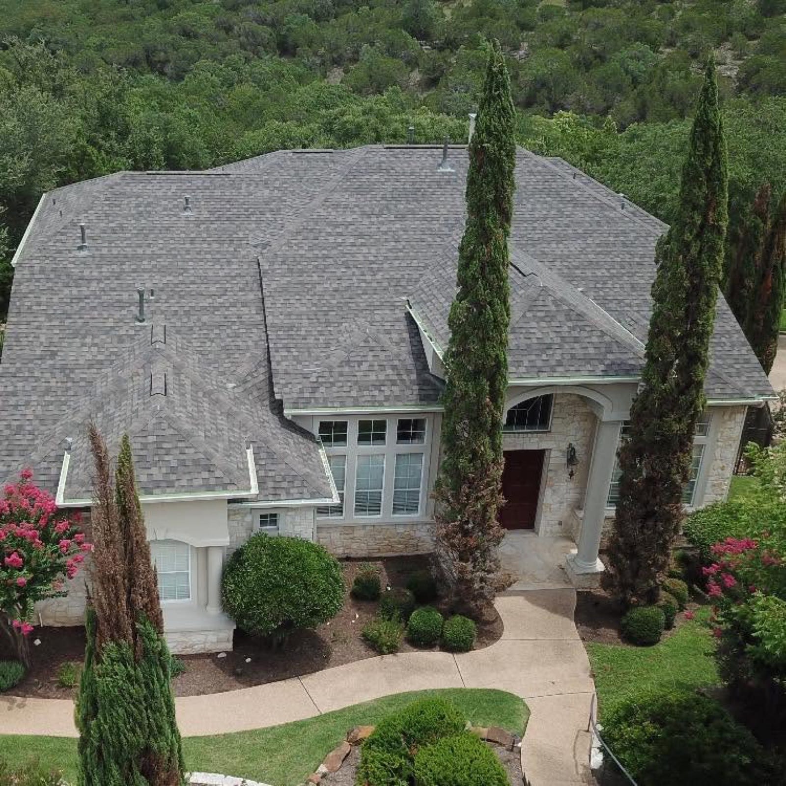 Aerial view of an Austin home with an asphalt shingle roof