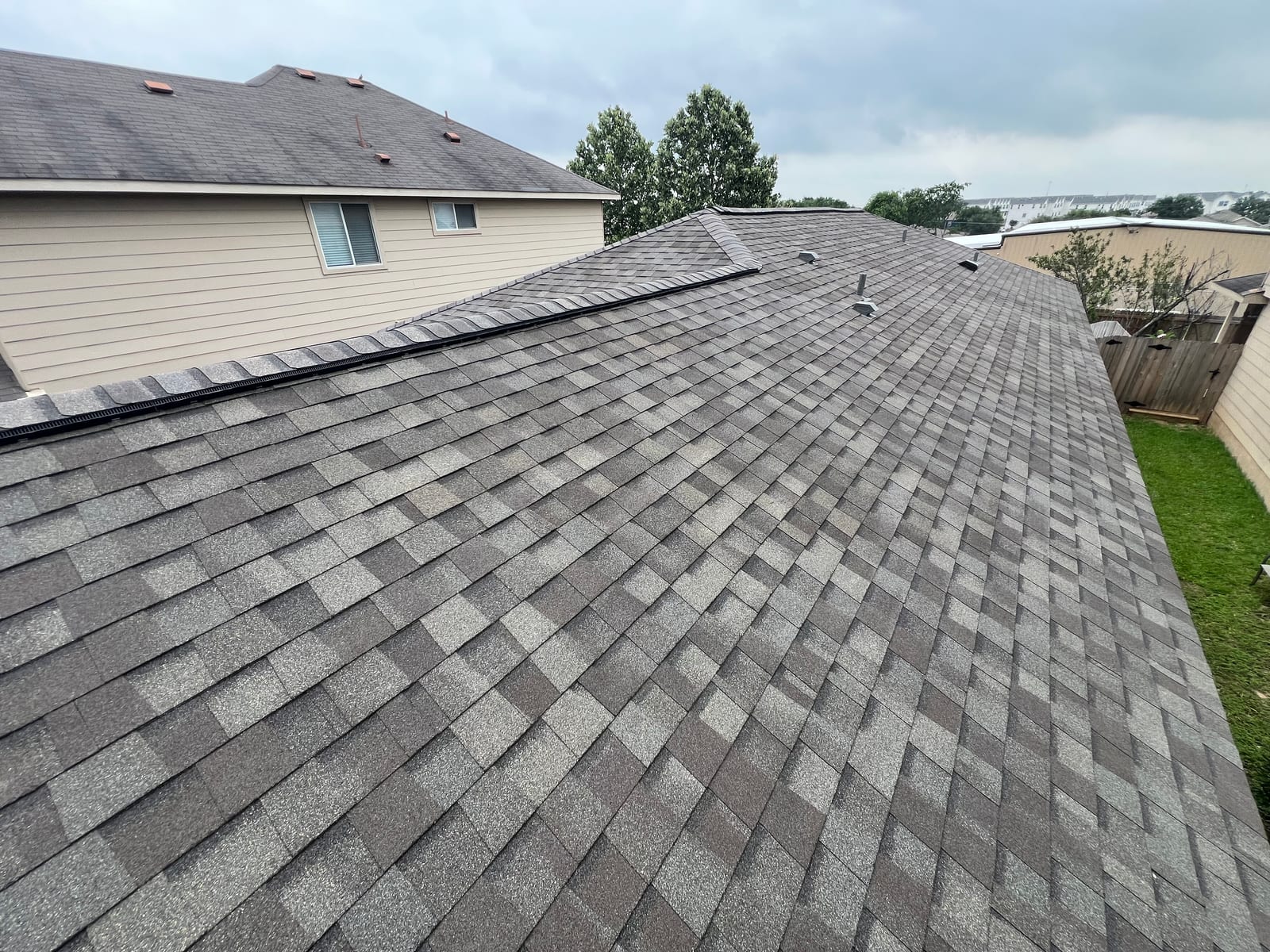 Rear slope of the new shingle roof above the back yard