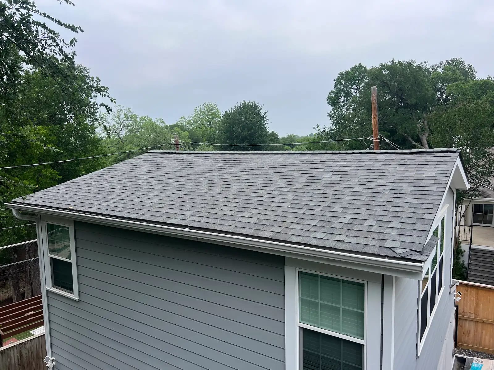 New Georgetown Gray architectural shingle roof with a new gutter run along the eave